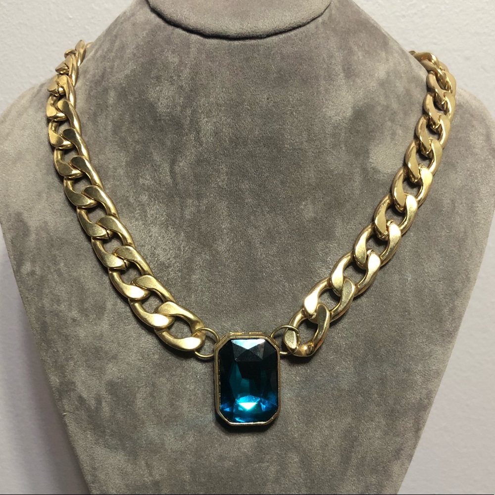Gold necklace with blue stone